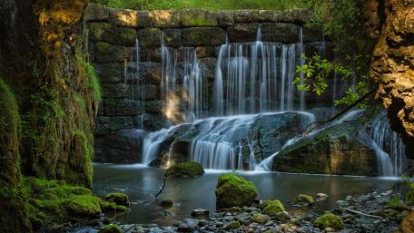 Serene Beauty of an Artificial Waterfall in 5K wallpaper