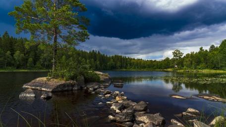 Dark Skies Over Tranquil Waters wallpaper