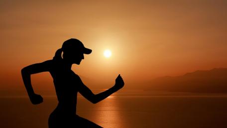 Empowered Runner in Sunset Glow wallpaper