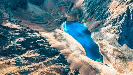 Tranquil Blue Lake in Serene Mountain Landscape wallpaper