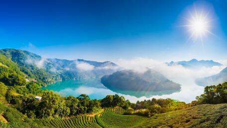 Tranquil Riverbend Under Clear Blue Skies wallpaper