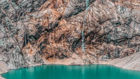 Breathtaking Rock Formation Above Tranquil Lake wallpaper