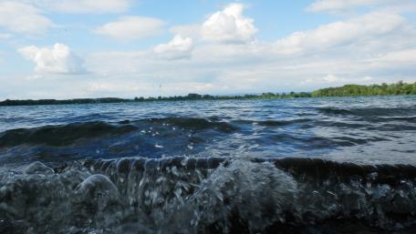 Serene Lake View Under a Cloudy Sky wallpaper
