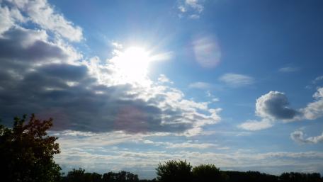 Sunny Serenity Under a Cloudy Sky wallpaper