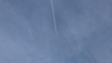 Serene Sky with Airplane Contrails wallpaper
