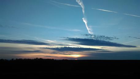 Serene Evening Sunset Over a Calm Horizon wallpaper