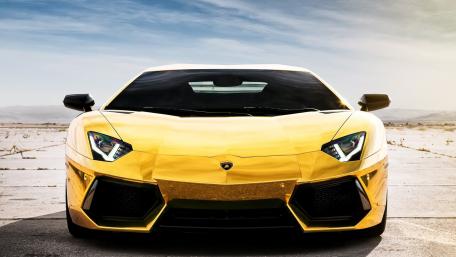 Golden Lamborghini Aventador in a Stunning Desert Landscape wallpaper