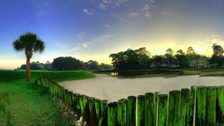 Tranquil Sunset Over Lush Landscape wallpaper