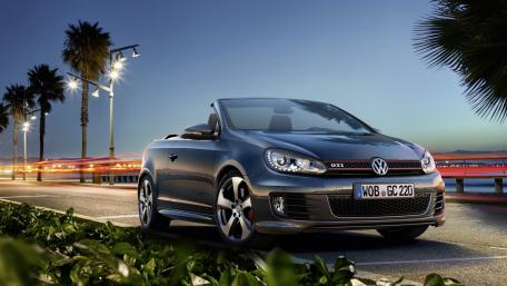 Sleek Volkswagen Cabriolet Under Night Lights wallpaper