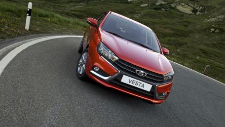 Sleek Lada Vesta on a Scenic Curve wallpaper