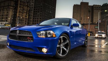 Bold Blue Dodge Charger in Urban Setting wallpaper