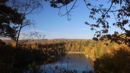 Vibrant Autumn Landscape at a Tranquil Lake wallpaper