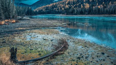 Calm River Beneath Mountain Peaks wallpaper