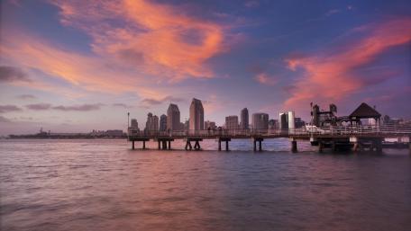 Cityscape Under a Pink Sky at Dusk wallpaper