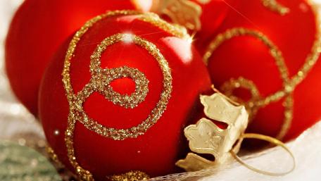 Festive Red Ornaments for Christmas Celebration wallpaper