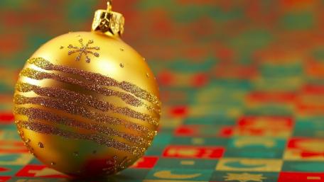Golden Christmas Ball on Colorful Background wallpaper