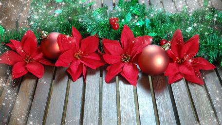 Festive Christmas Arrangement with Flowers and Ornaments wallpaper