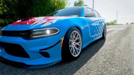 Vibrant Blue Sports Car on the Road wallpaper
