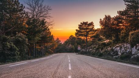 Serenity of the Empty Road at Sunset wallpaper