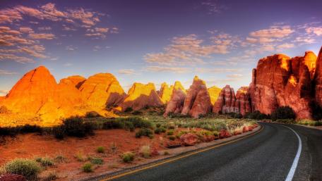 Majestic U.S. Route 66 through Stunning Desert Landscape wallpaper