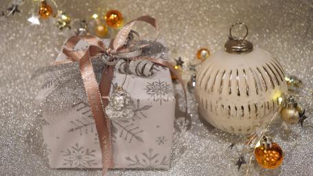 Elegant Christmas Gift with Shimmering Decorations wallpaper