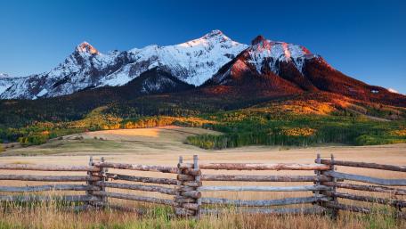Serene Mountain Landscape with Wooden Fence wallpaper