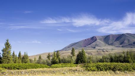 Serene Mountain Landscape Under Clear Blue Sky wallpaper
