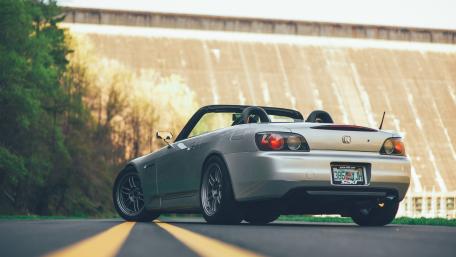 Sleek Honda S2000 Cabrio in Nature's Embrace wallpaper