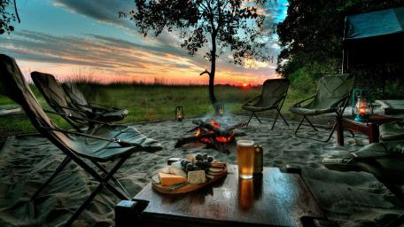 Serene Camping Sunset with Appetizers and Beer wallpaper