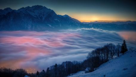 Fog over the forest in the mountains wallpaper