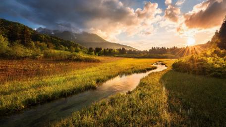 Serene Alpine Brook at Sunset wallpaper