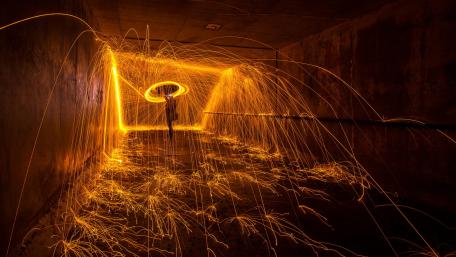 Fiery Whirls of Light in Darkness wallpaper