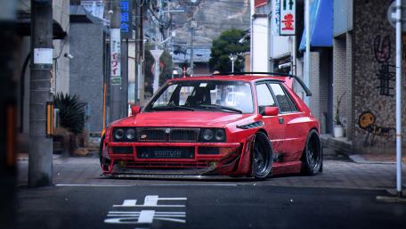 Lancia Delta in Urban Setting wallpaper