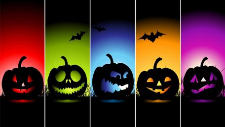 Vibrant Pumpkin Silhouettes Glow in the Dark wallpaper