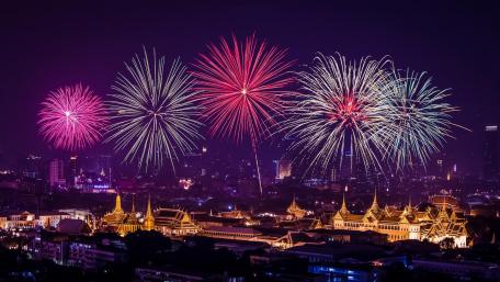 Vibrant New Year Fireworks Over Cityscape wallpaper