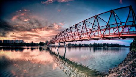 Stunning Sunset Over Red Iron Bridge wallpaper