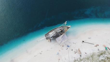 Abandoned Beauty of a Shipwreck by the Shore wallpaper