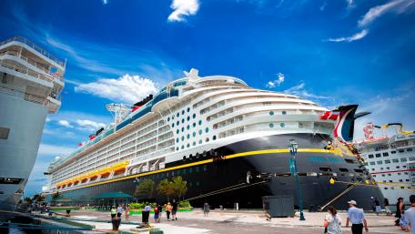 Massive Cruise Ship Docked in Vibrant Port wallpaper