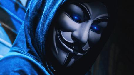 Mysterious Hacker in Blue Hoodie wallpaper