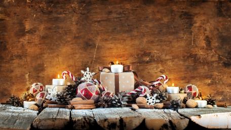 Cozy Christmas Celebration Scene with Candles and Decorations wallpaper