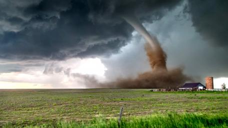Whirlwind Over Tranquil Grasslands wallpaper