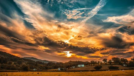 Breathtaking Sunset Over Tranquil Countryside Landscape wallpaper
