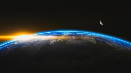 Radiant Sunrise Over Earth and Moon wallpaper