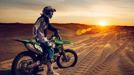 A motorbike in the sand wallpaper