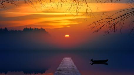 Serene Sunset Over Misty Lake Shoreline wallpaper