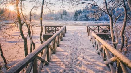 Snowy Pier at Frozen Lake Winter Serenity wallpaper