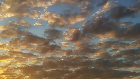 Golden Clouds at Sunrise Glow wallpaper