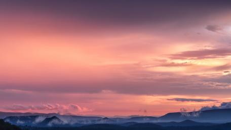 Serene Dusk Over Misty Mountains wallpaper