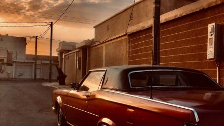 Vintage Car in Sunset Glow wallpaper