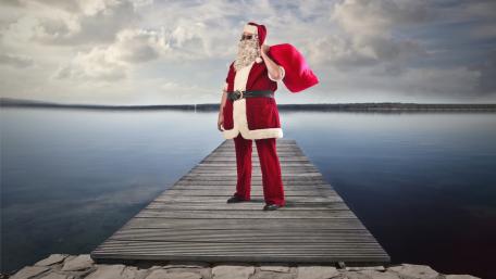 Jolly Santa on a Peaceful Pier wallpaper